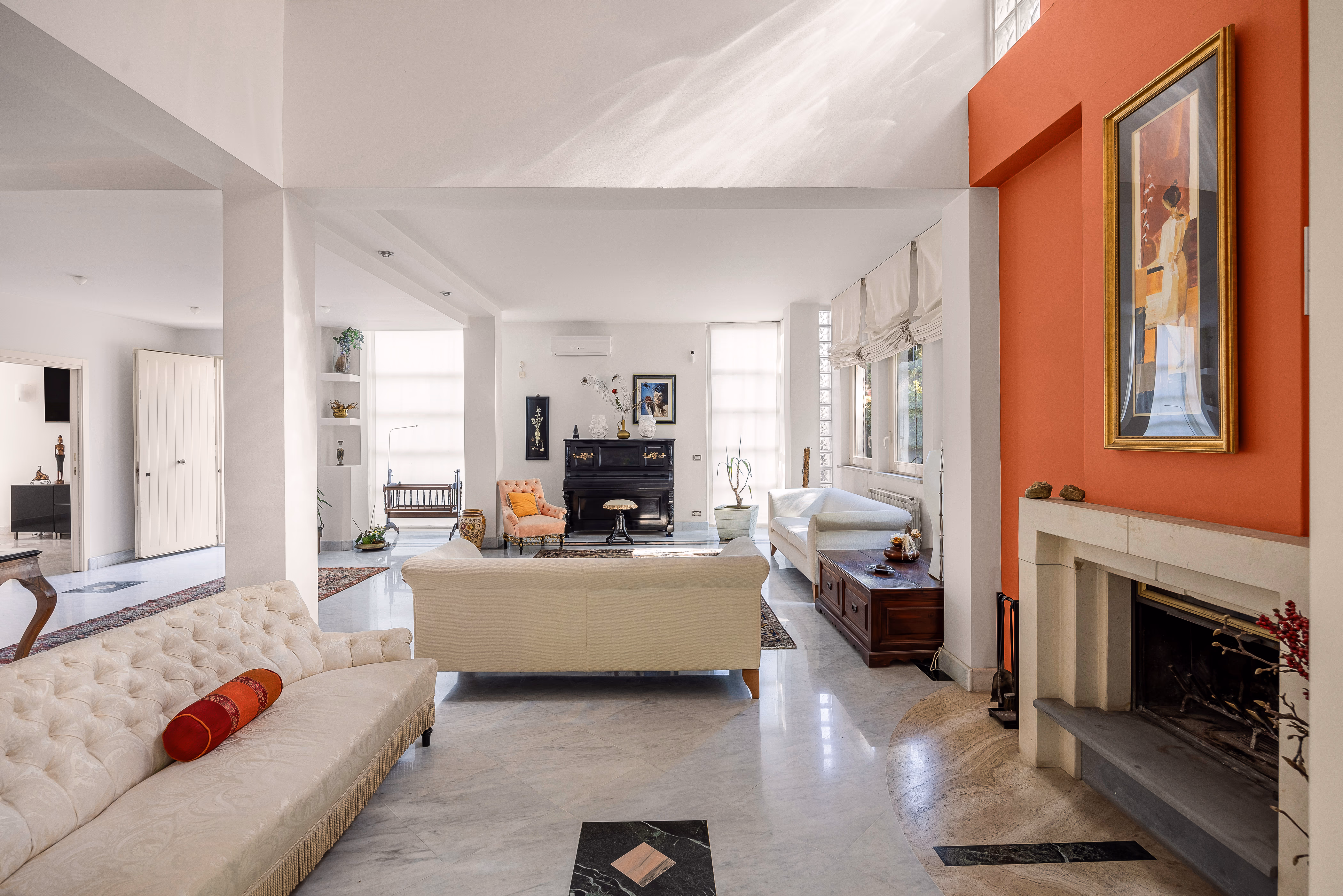 Interior hallway with polished floor and natural light