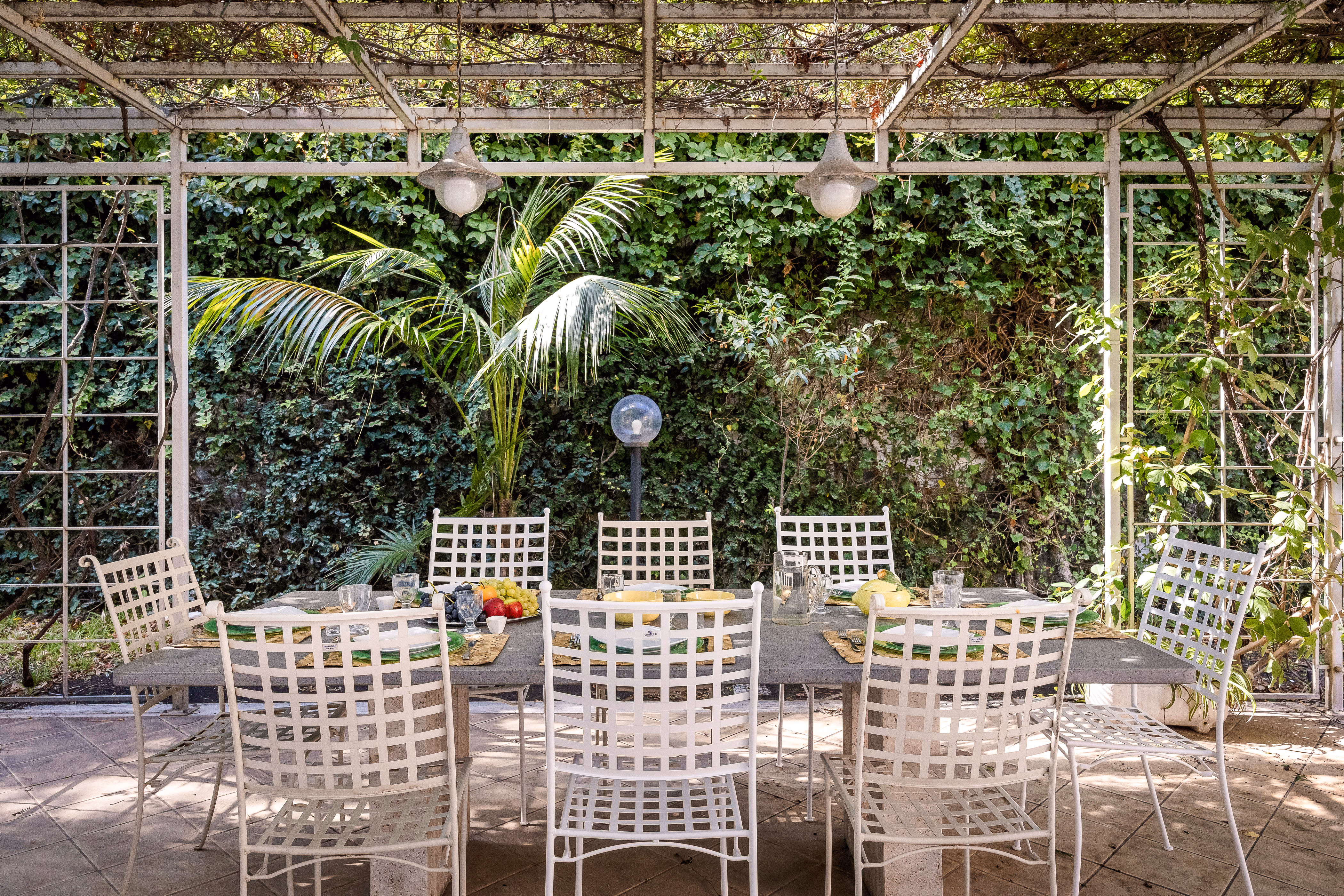 Outdoor jacuzzi set within the garden at Villa Rosaria