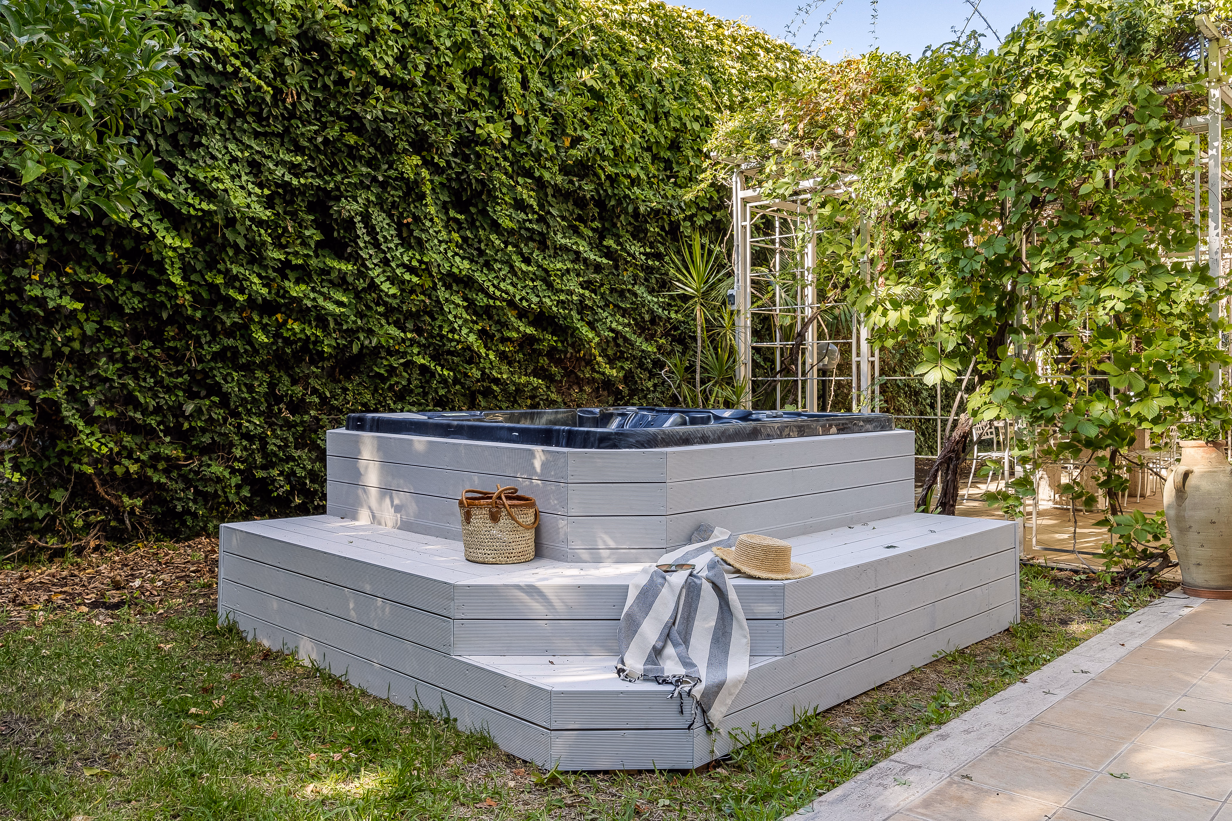 Citrus trees and landscaped garden with villa facade