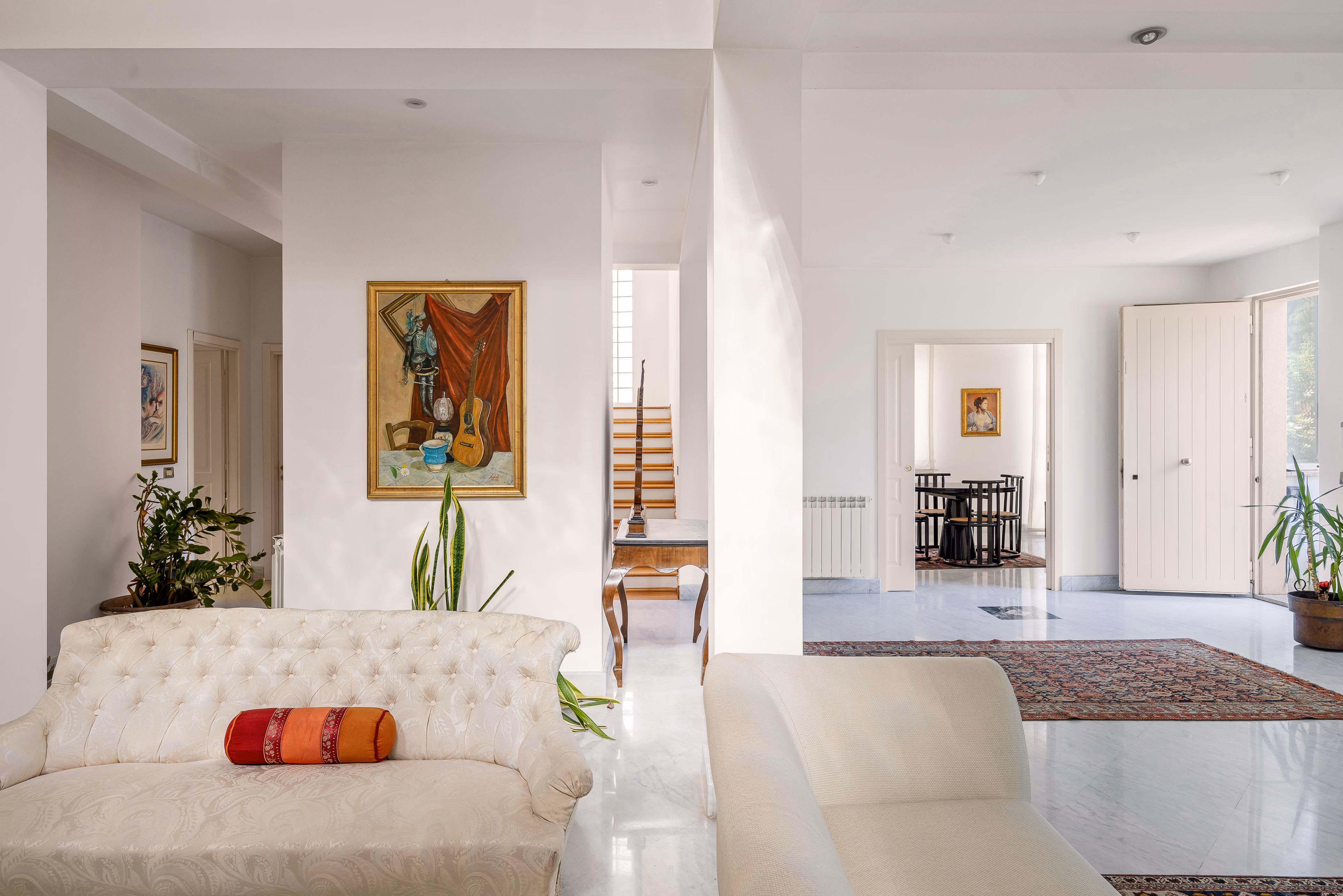 Ground floor living area with fireplace and archway