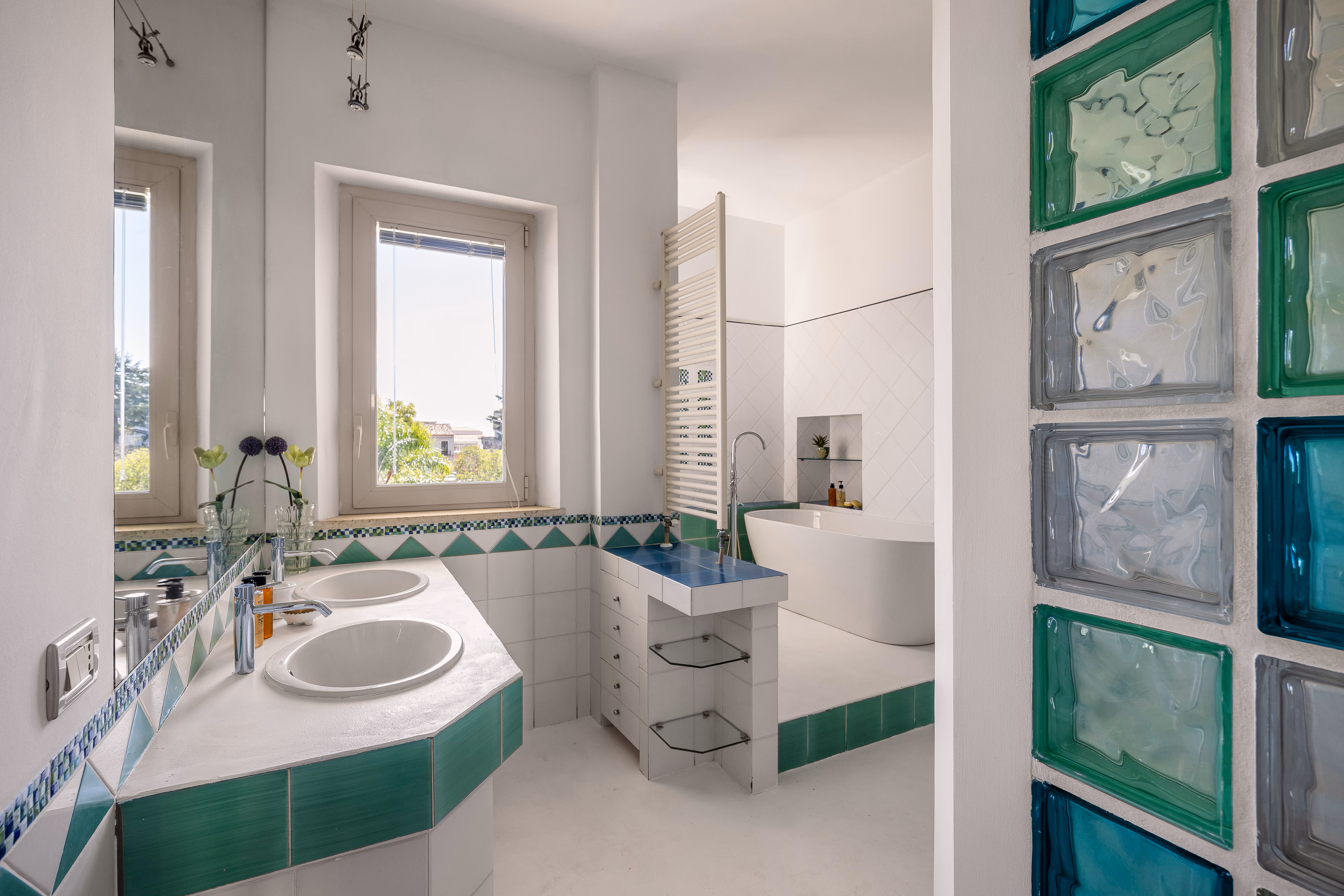 Bathroom with terracotta floor and white fixtures