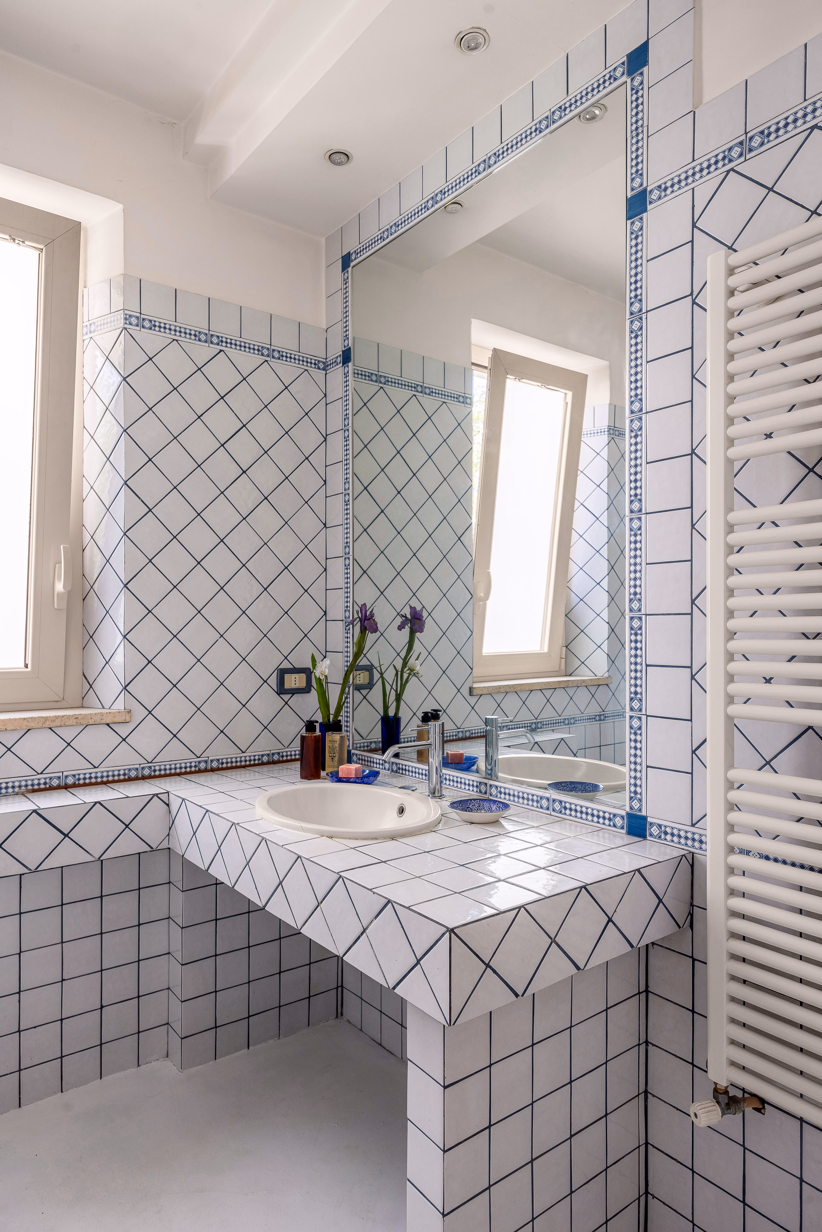 Kitchen detail with tiled backsplash and wooden shelving