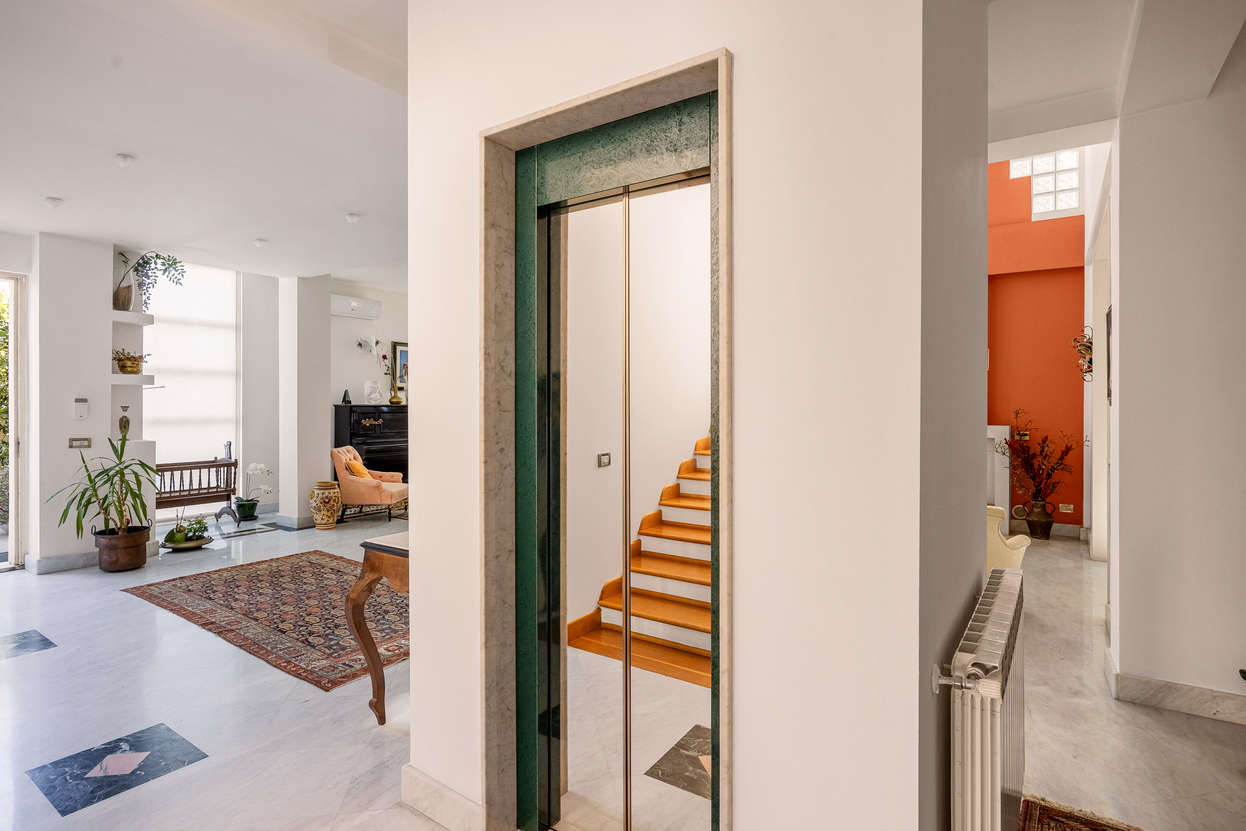 Stairwell with skylight and white walls