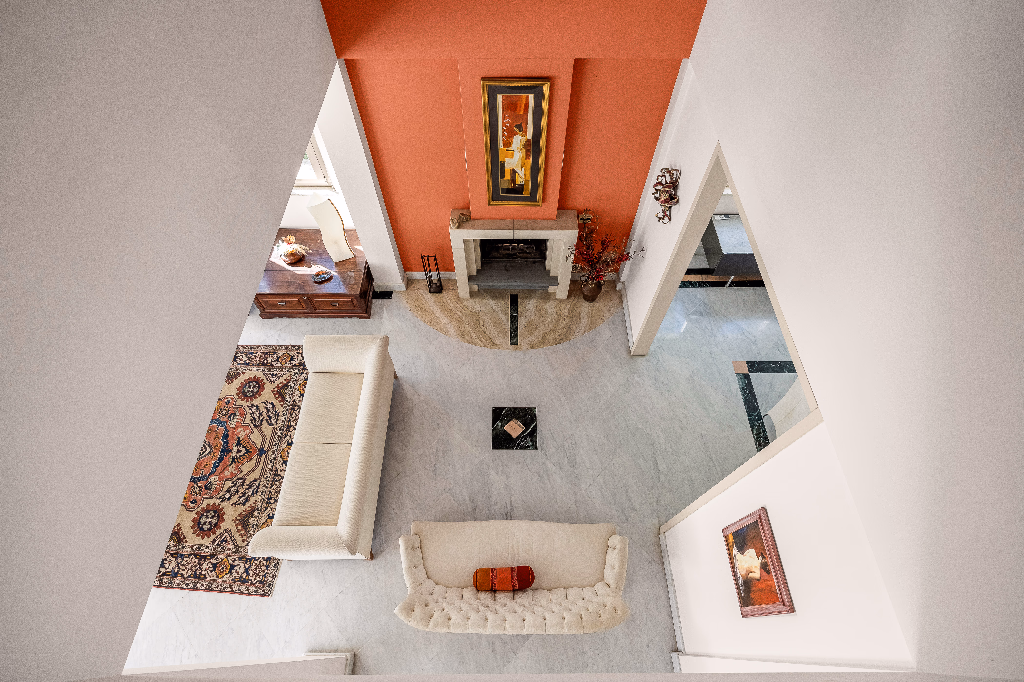 Secondary living area with bookshelves and warm light